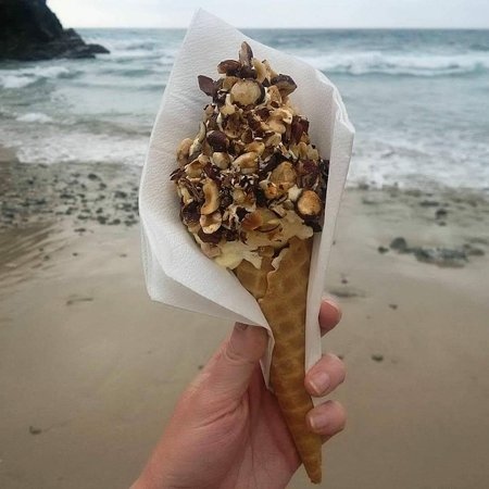 Hedgehog ice cream with Chapel Porth Beach behind